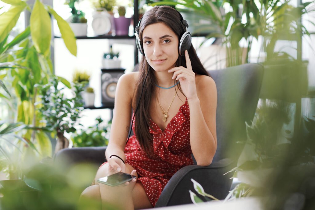 Woman relaxing at home and using a smartphone