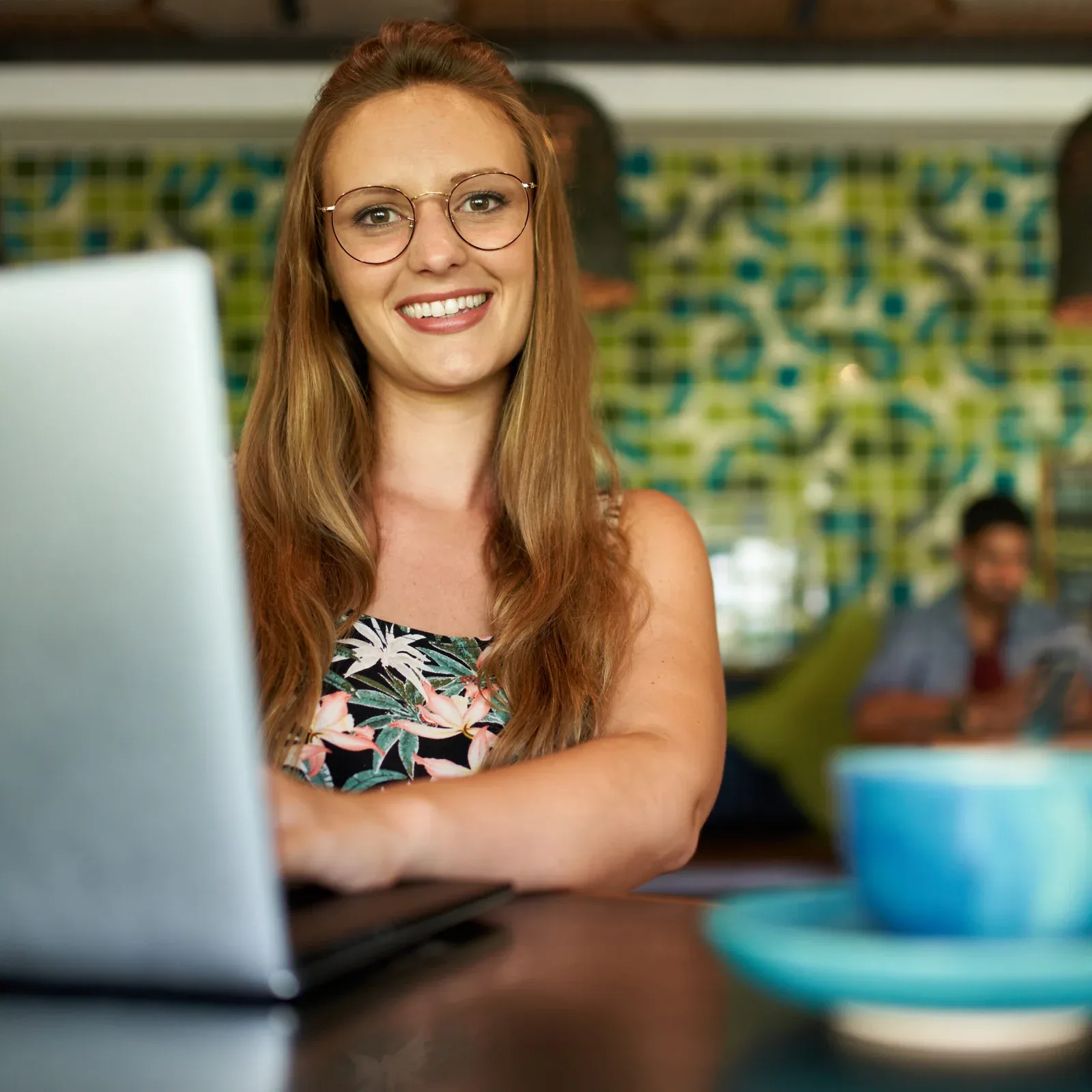 Attractive millennial woman smiling happily while working in boh